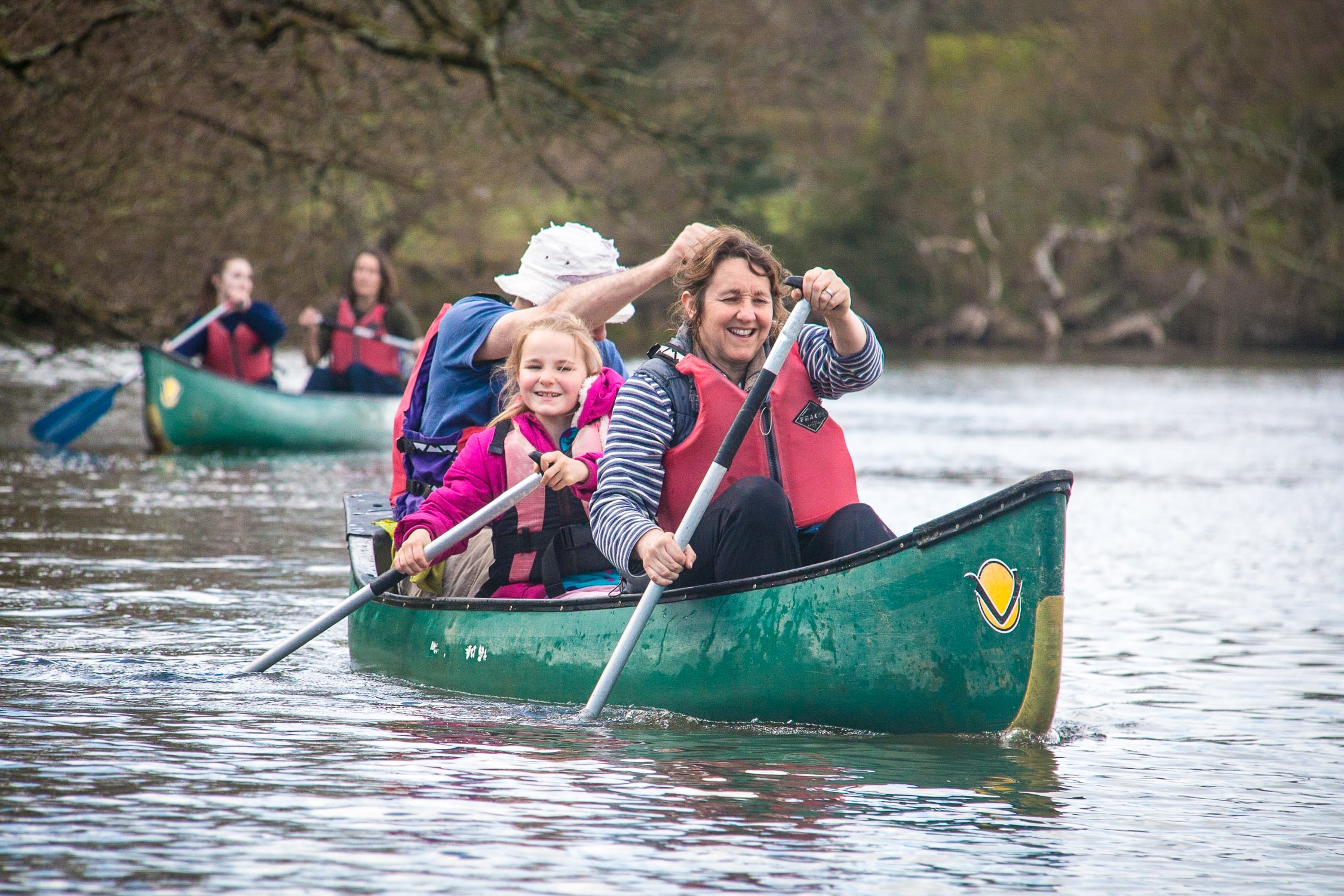 A family in a canoe in cold weather