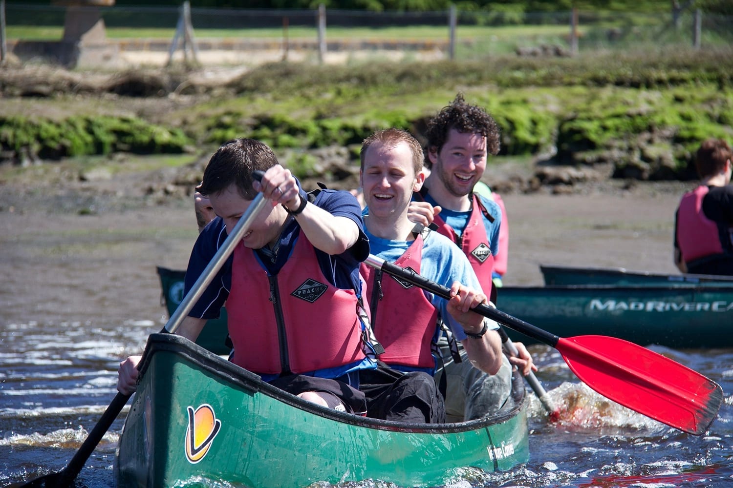 Friends enjoying a paddle to the pub.