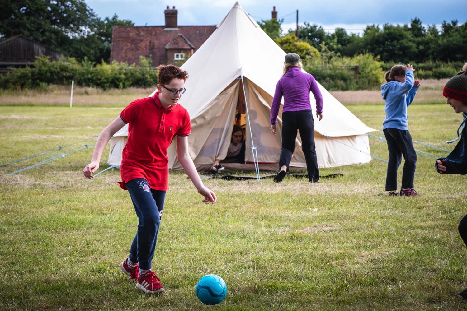 A boy enjoying camping in the new forest with his family