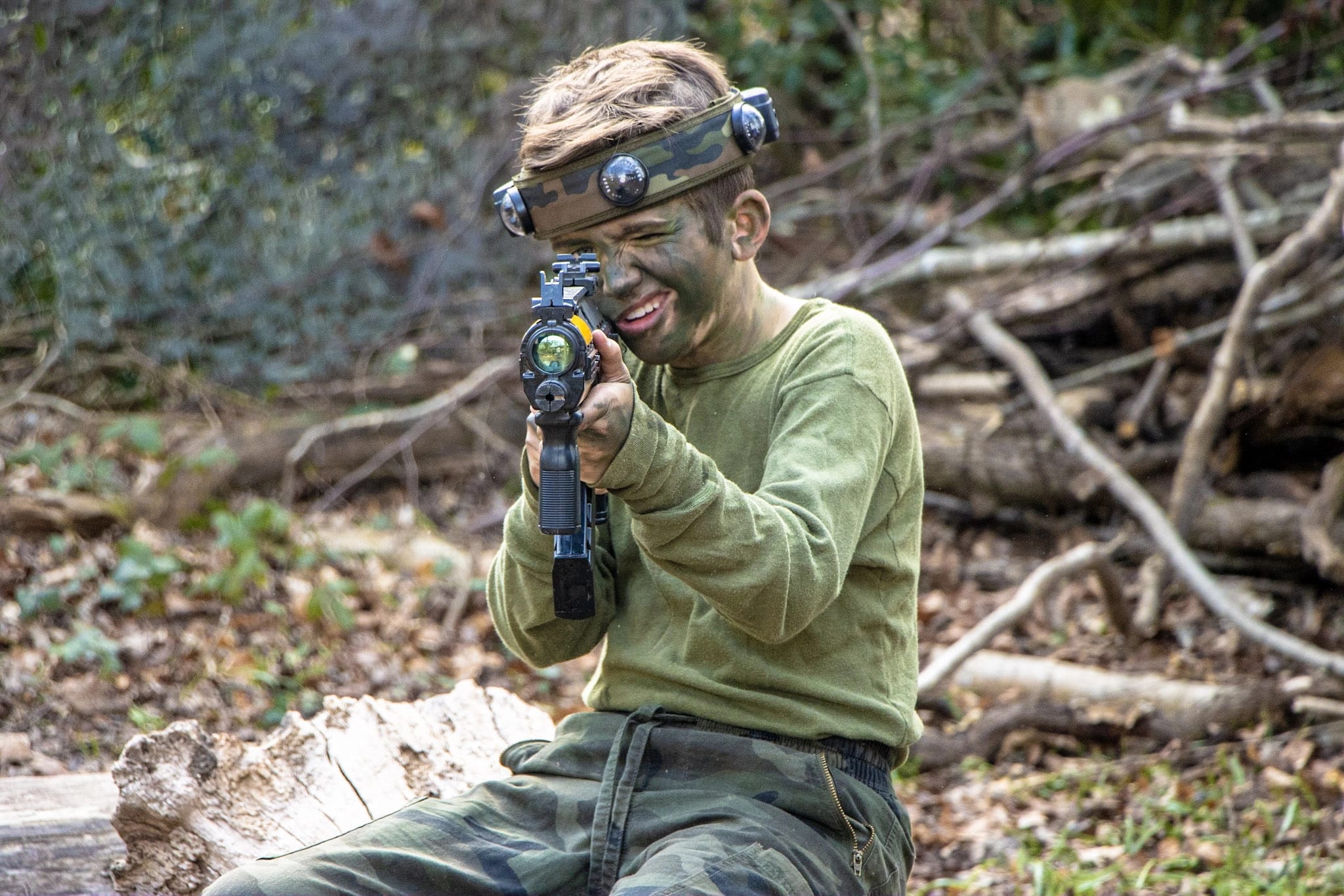 A boy playing the laser tag game, BattleZone