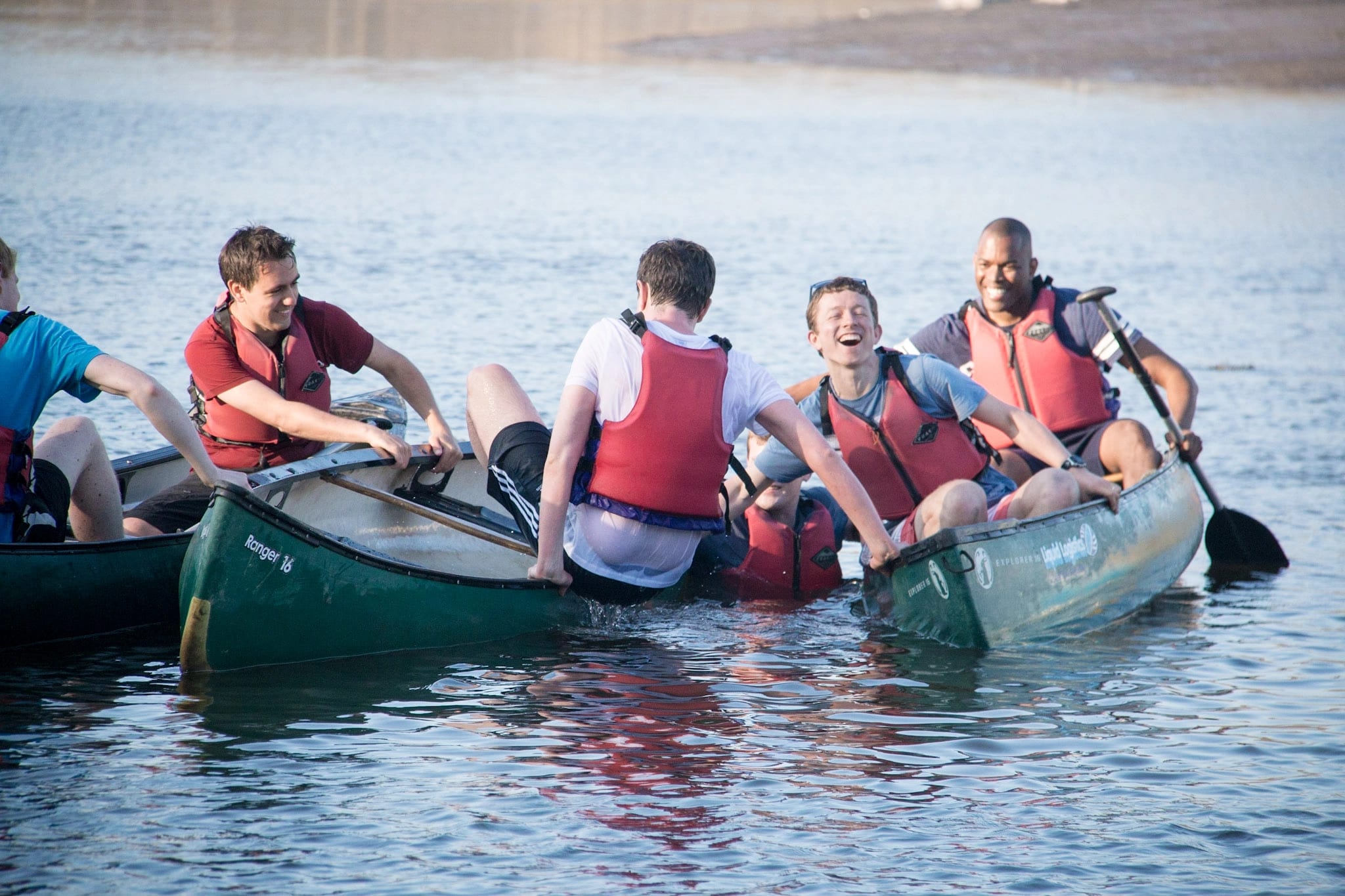 Man falling from a canoe. 