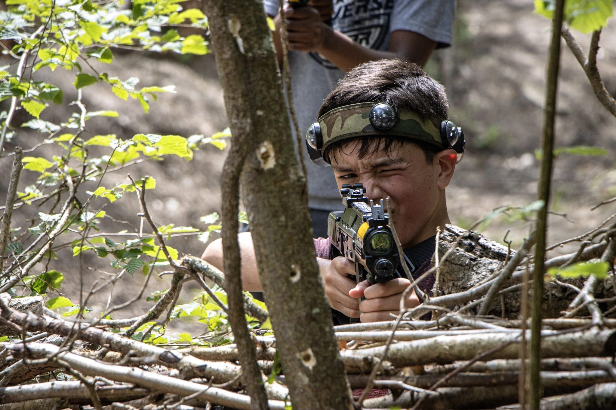 A boy enjoying a BattleZone laser tag session