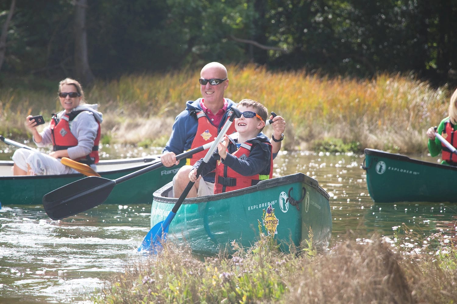 A Dad and his son enjoying a family canoeing session with New Forest Activities.