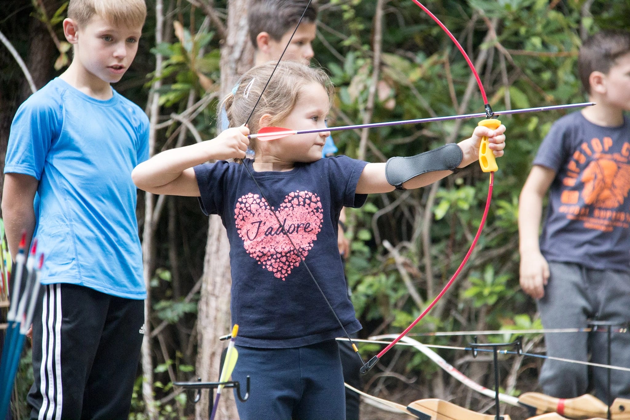 A daughter taking part in a Family Archery session.