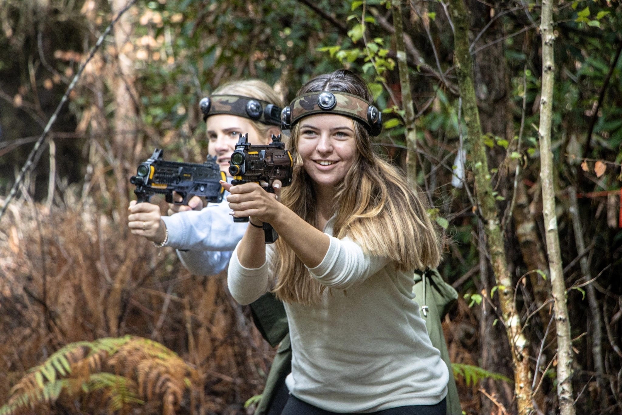 Two colleagues enjoying BattleZone laser tag at New Forest Activities as part of a Team Huddle day