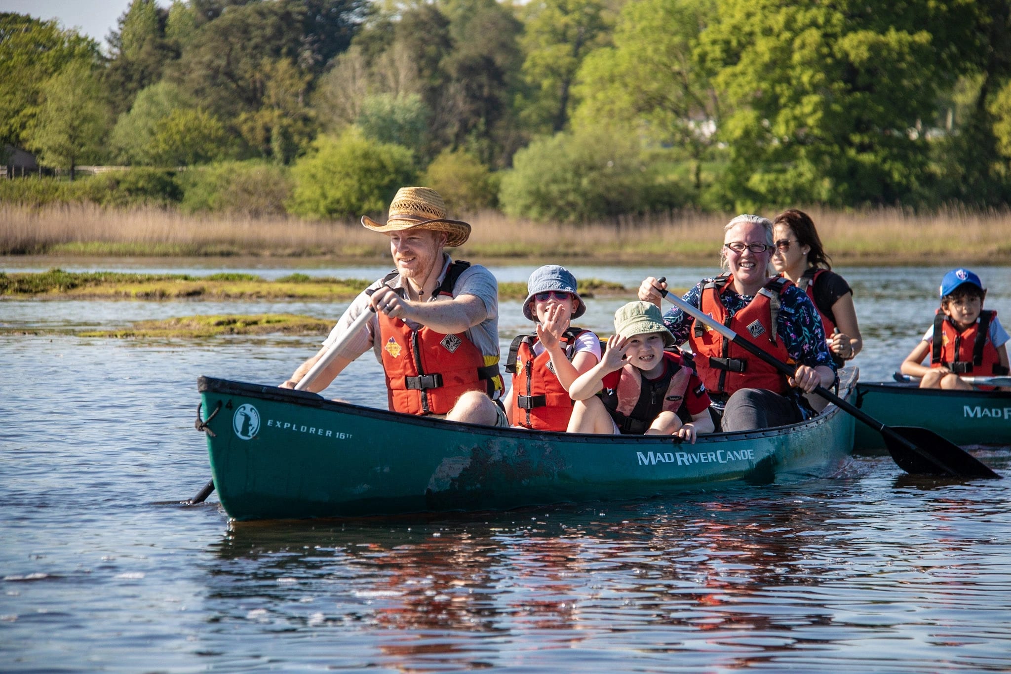 A family canoeing on the Beaulieu River